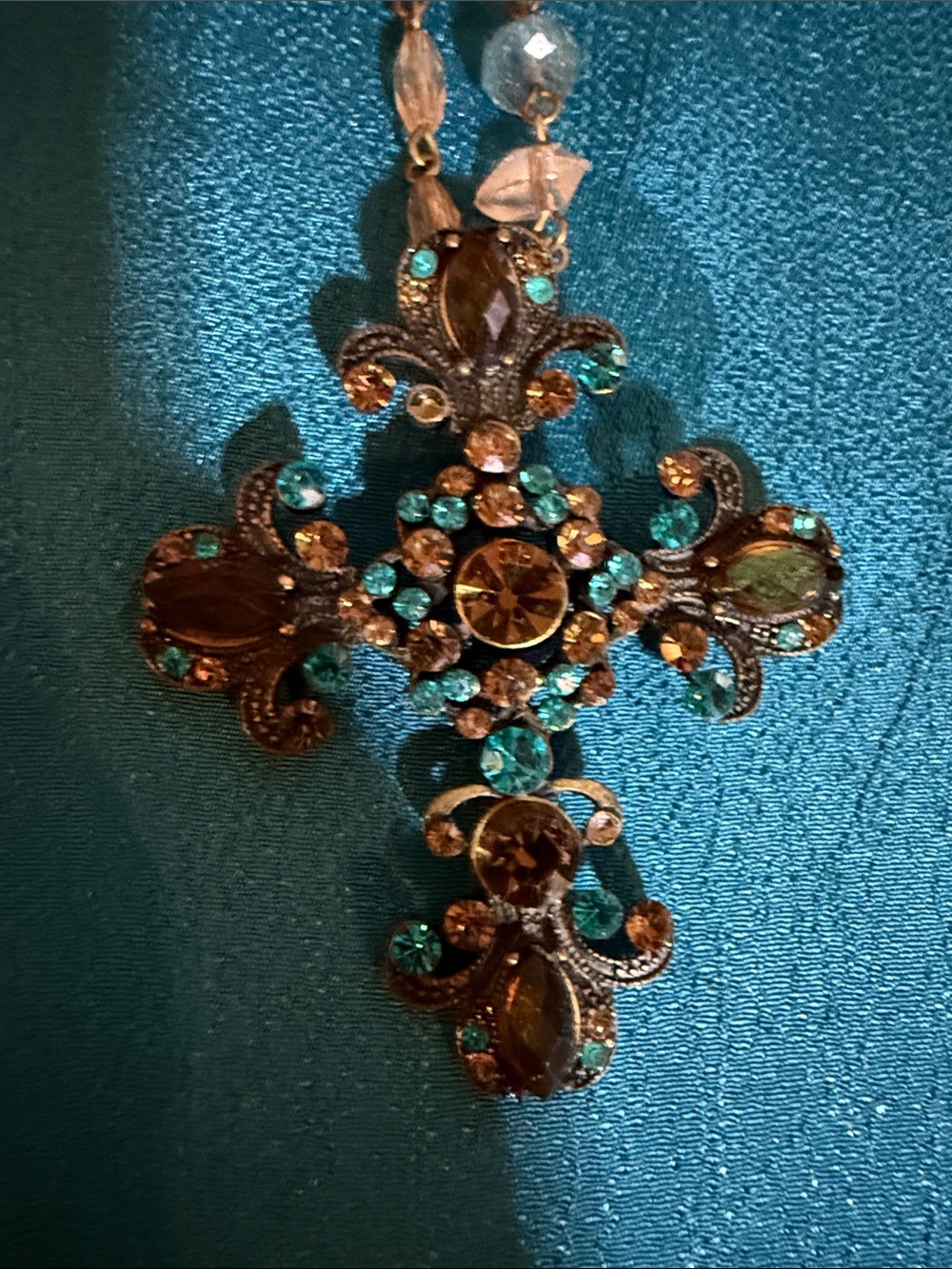 Decorative Teal and Amber Jeweled Cross necklace
